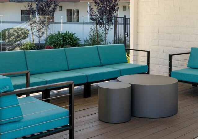 Apartments for Rent Hayward CA - Jackson Flats - Modern patio set with vibrant blue cushions