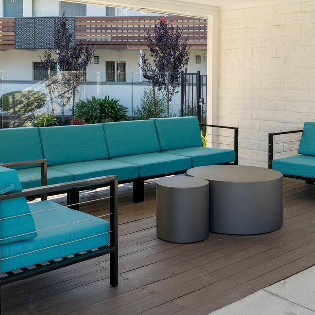 Apartments for Rent Hayward CA - Jackson Flats - Modern patio set with vibrant blue cushions